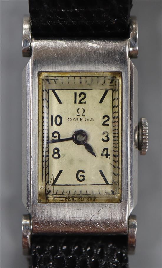 A ladys stainless steel Omega manual wind rectangular cased wrist watch, on later associated strap.